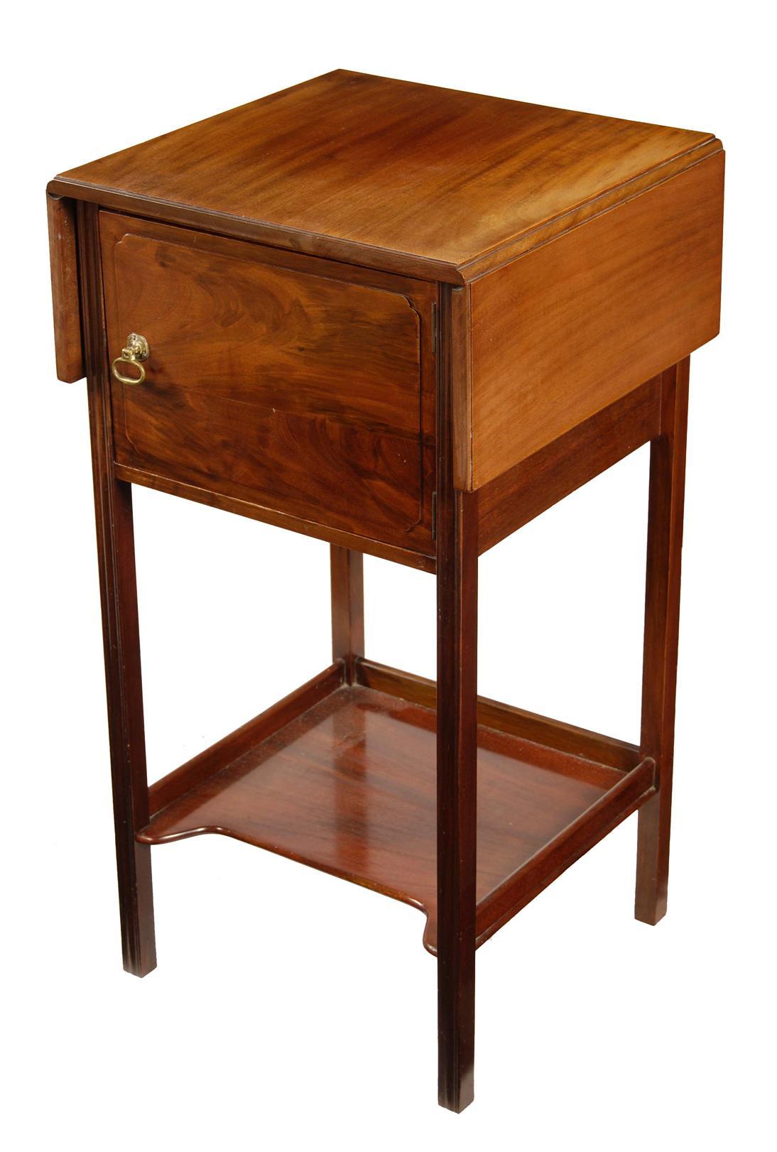 Appraisal: A mahogany bedside cupboard in George III style by Heal