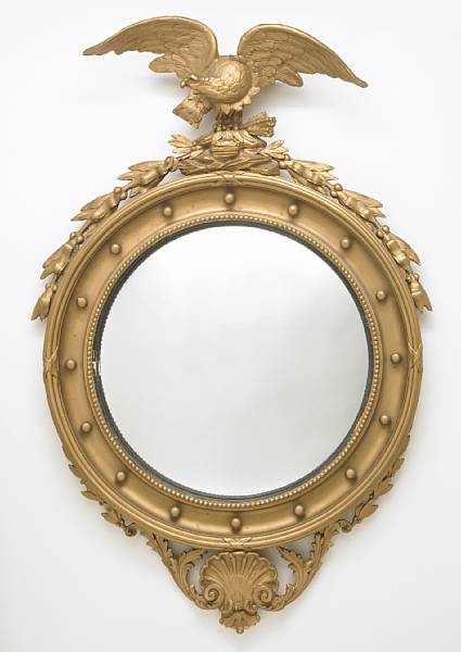 Appraisal: A Regency style carved giltwood convex mirror th century height