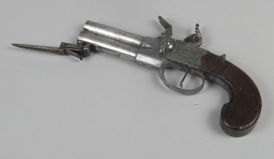 Appraisal: An early thC double barreled flintlock pistol with retractable bayonet