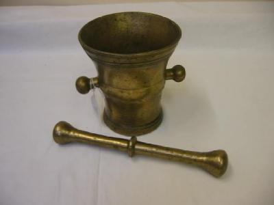 Appraisal: A BRASS MORTAR of mildly baluster form with flared rim