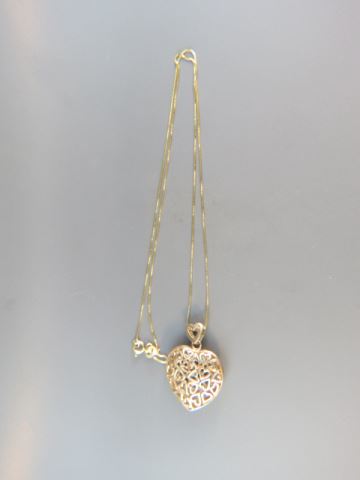 Appraisal: k Gold Open Heart Pendant silver on one side chain