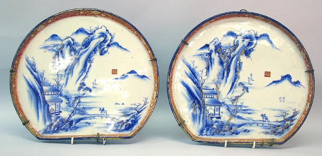 Appraisal: Two similar th century Japanese pottery fan shaped dishes painted