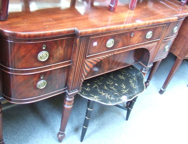 Appraisal: A George IV mahogany bowfront sideboard with a breakfront top