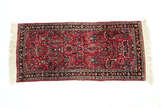 Appraisal: ORIENTAL RUG Ca s Sarouk Burgundy ground Added fringe '