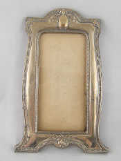 Appraisal: A silver faced oak photo frame x cm tall Birmingham