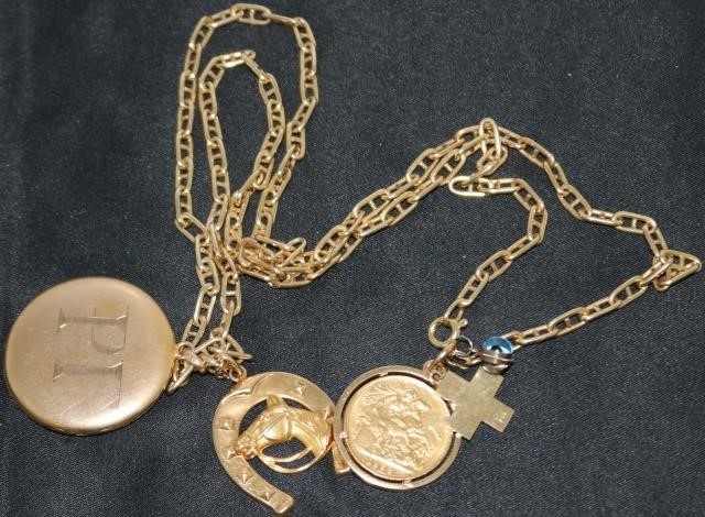 Appraisal: KT YELLOW GOLD CHAIN WITH KT CROSS BRITISHGOLD COIN IN