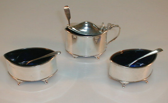 Appraisal: A George V silver navette shape cruet set comprising a