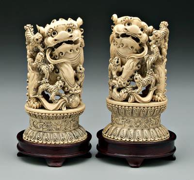 Appraisal: Pair Chinese ivory Buddhist lions male and female glass eyes