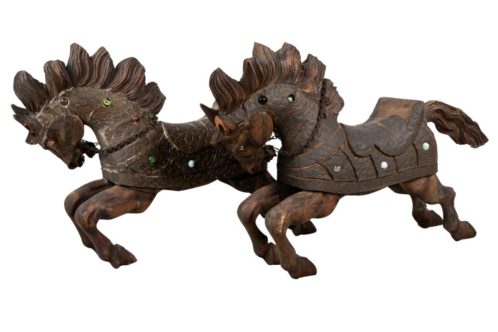 Appraisal: PAIR OF DECORATED CARVED WOOD HORSESCondition with two stones missing