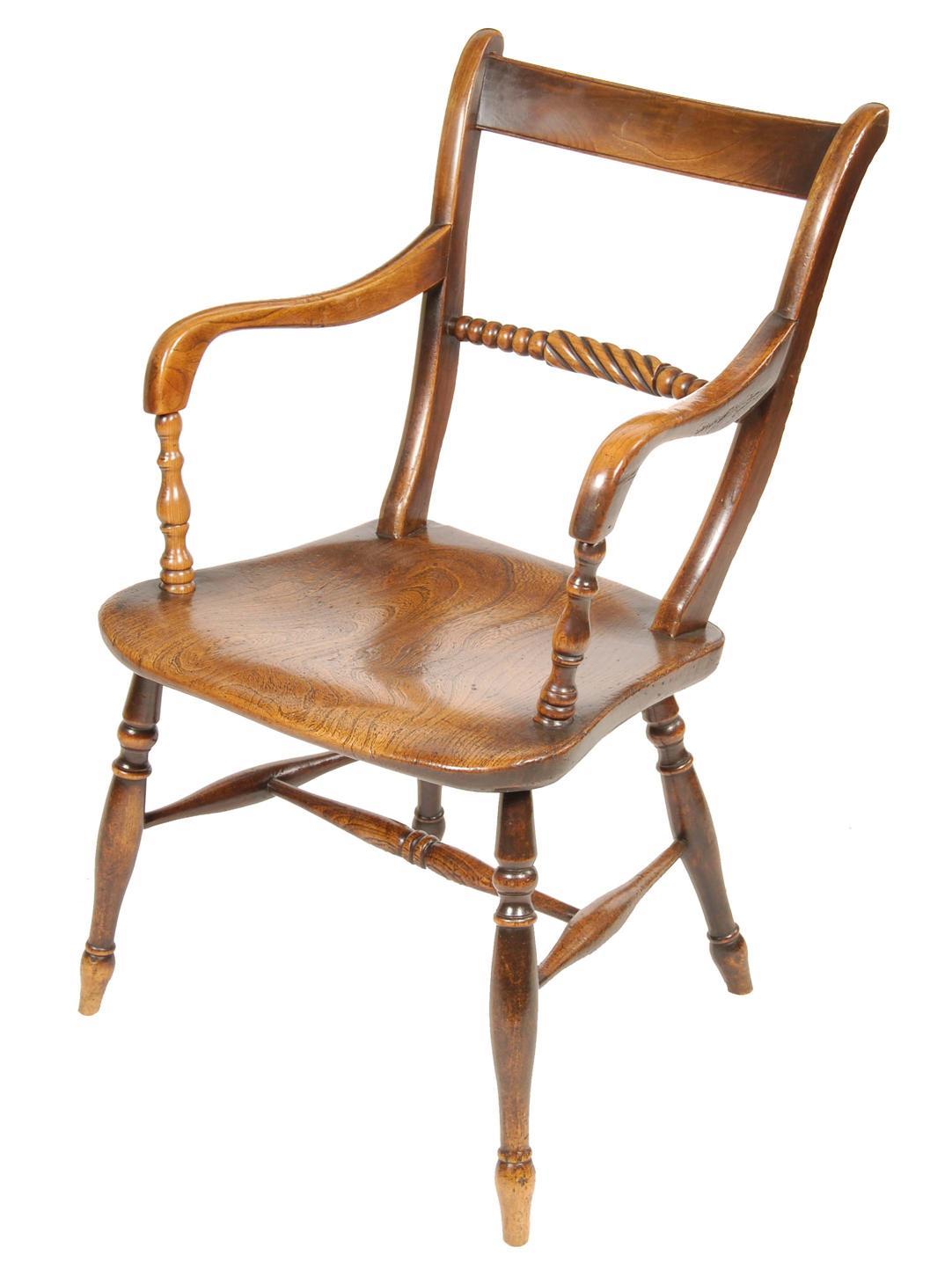 Appraisal: A th century Windsor fruitwood low back open armchair