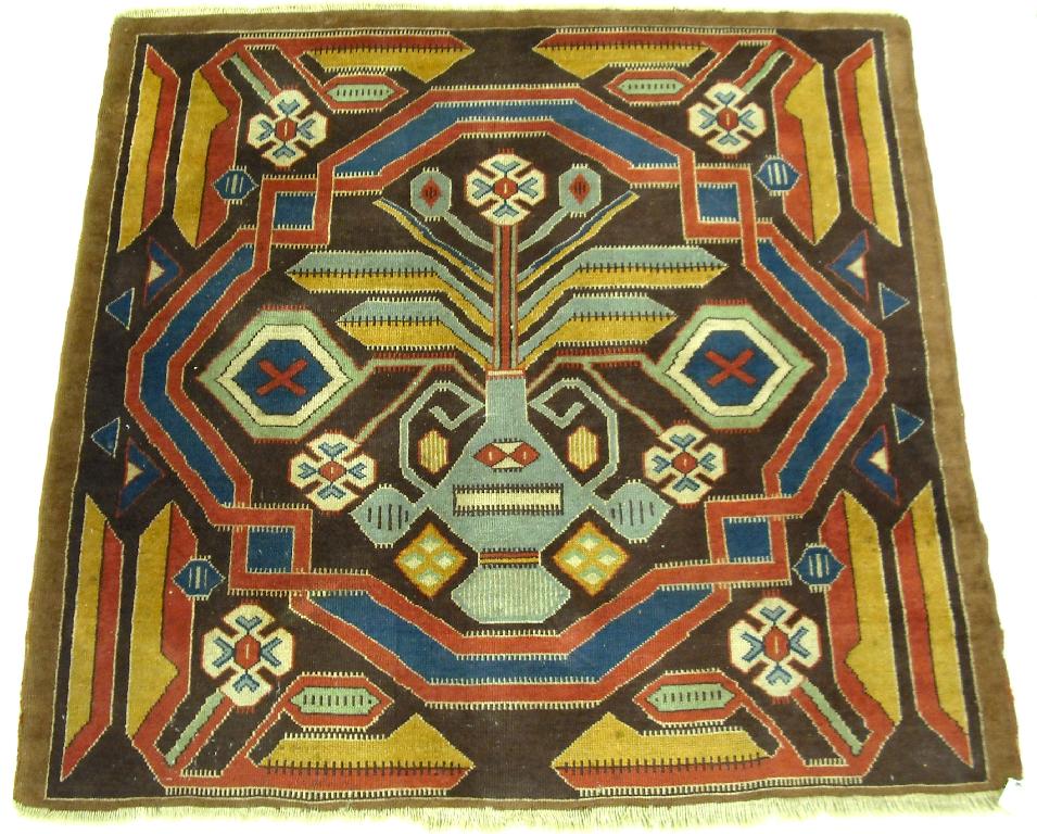 Appraisal: Caucasian square rug with a central vase motif with flowers