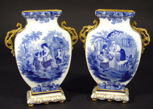 Appraisal: Pair of Copeland Spode china vases with pierced gilt handles