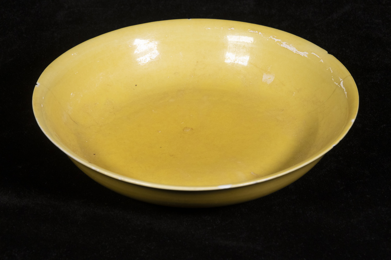 Appraisal: CHINESE QING IMPERIAL YELLOW SHALLOW BOWL Flared rim with shallow