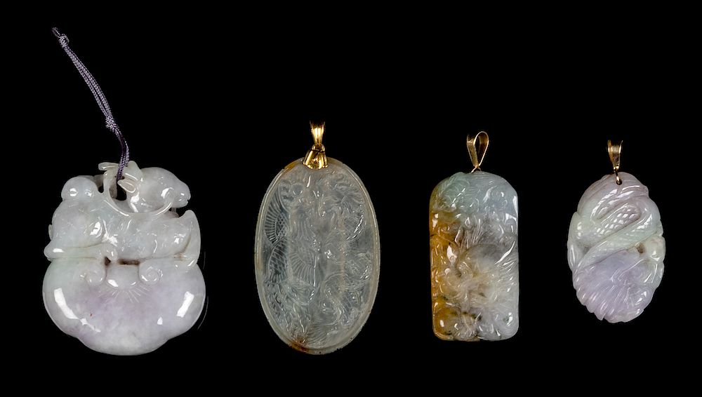 Appraisal: Four Chinese Jadeite Pendants Largest width in cm Four Chinese