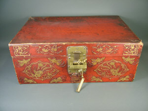 Appraisal: A Chinese red leather covered travelling trunk decorated with gilt