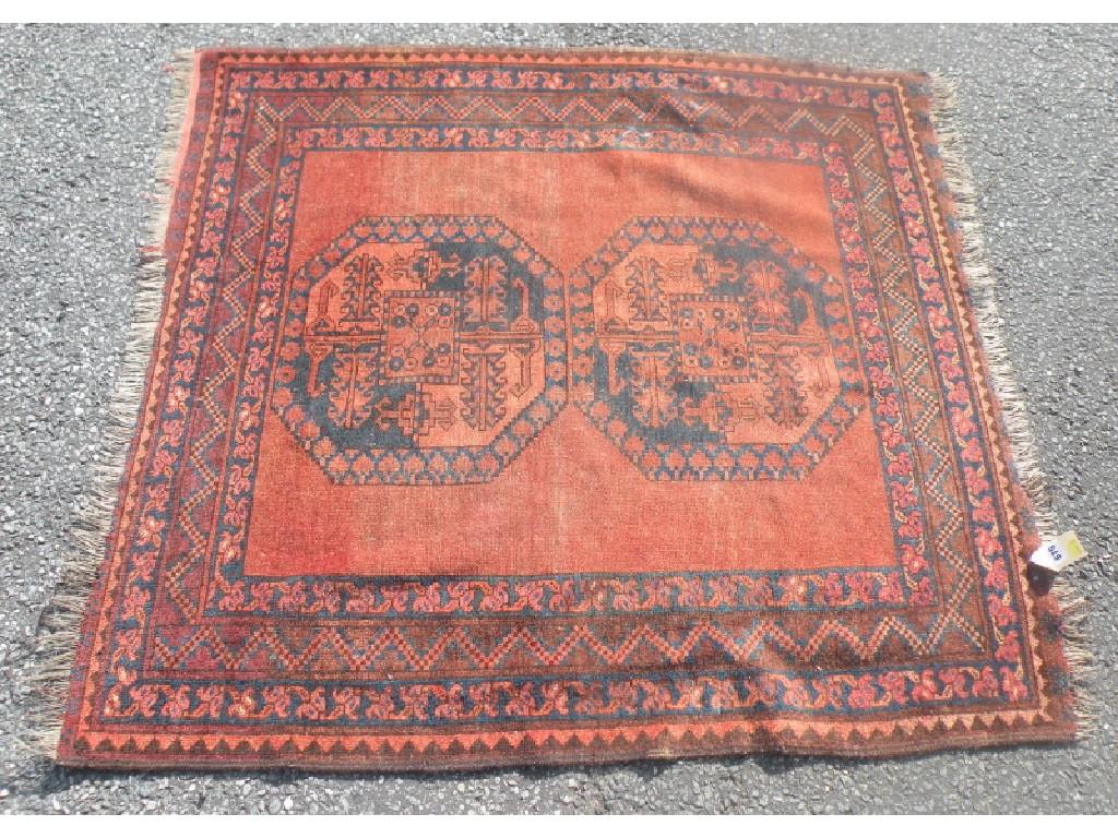 Appraisal: A Persian rug with two medallions on a rust groundProvenance