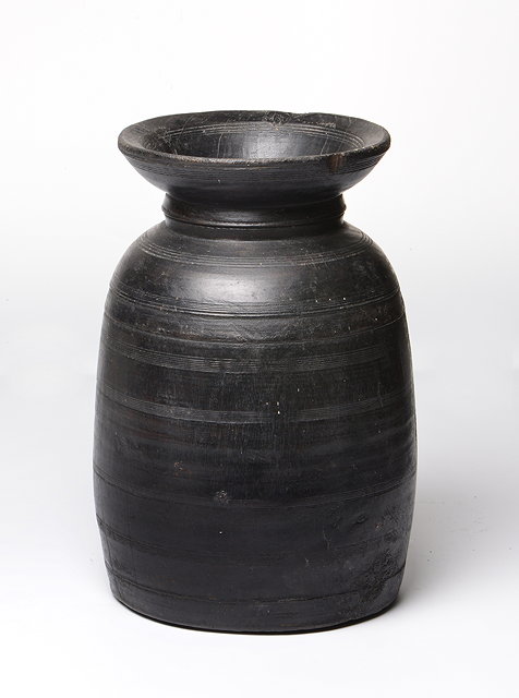 Appraisal: AN OMANI LARGE TURNED WOODEN POT cm tall