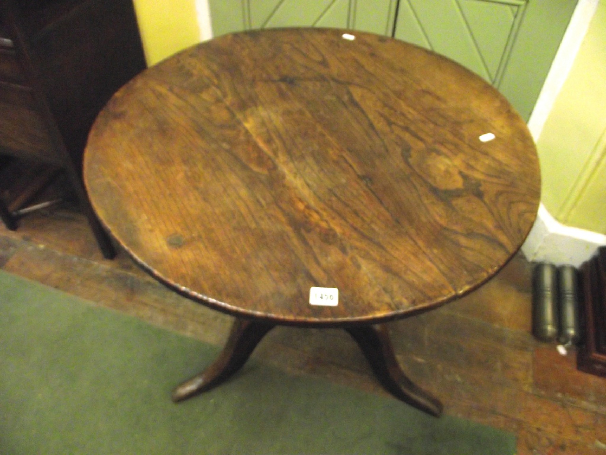 Appraisal: A substantial Georgian elm snap top table the circular top