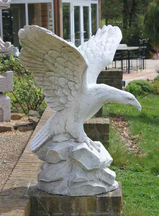 Appraisal: A composition garden statue modelled as an eagle ft Estimate