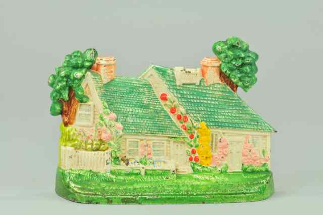 Appraisal: COTTAGE DOORSTOP Hubley depicts cast iron cottage with flowers growing