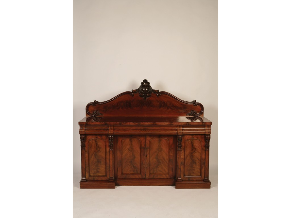 Appraisal: A VICTORIAN MAHOGANY TWIN PEDESTAL SIDEBOARD with a raised scrolling