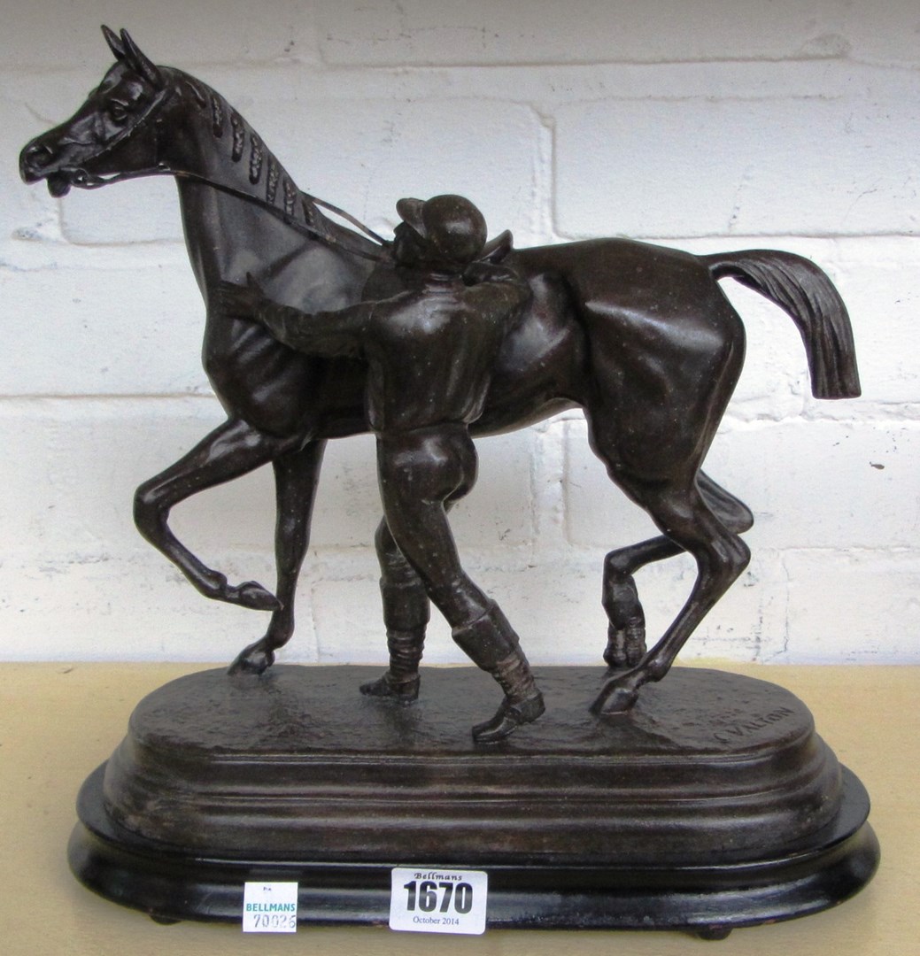 Appraisal: A cast spelter figure of a horse and jockey on