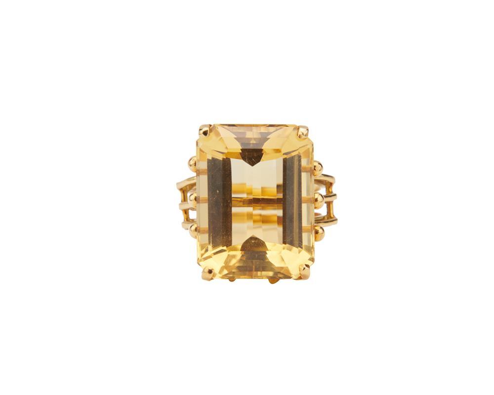 Appraisal: K Gold and Citrine Ring centering a rectangular step-cut citrine