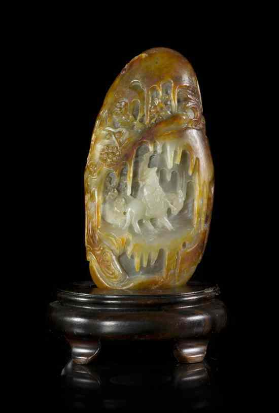 Appraisal: A Carved Jade Pebble having a russet skin depicting a