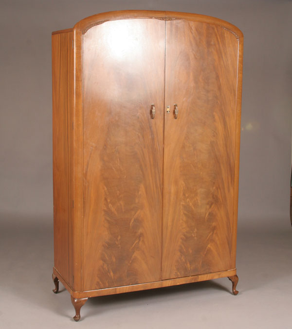 Appraisal: English Art Deco wardrobe bookmatch veneers arched top carved accents