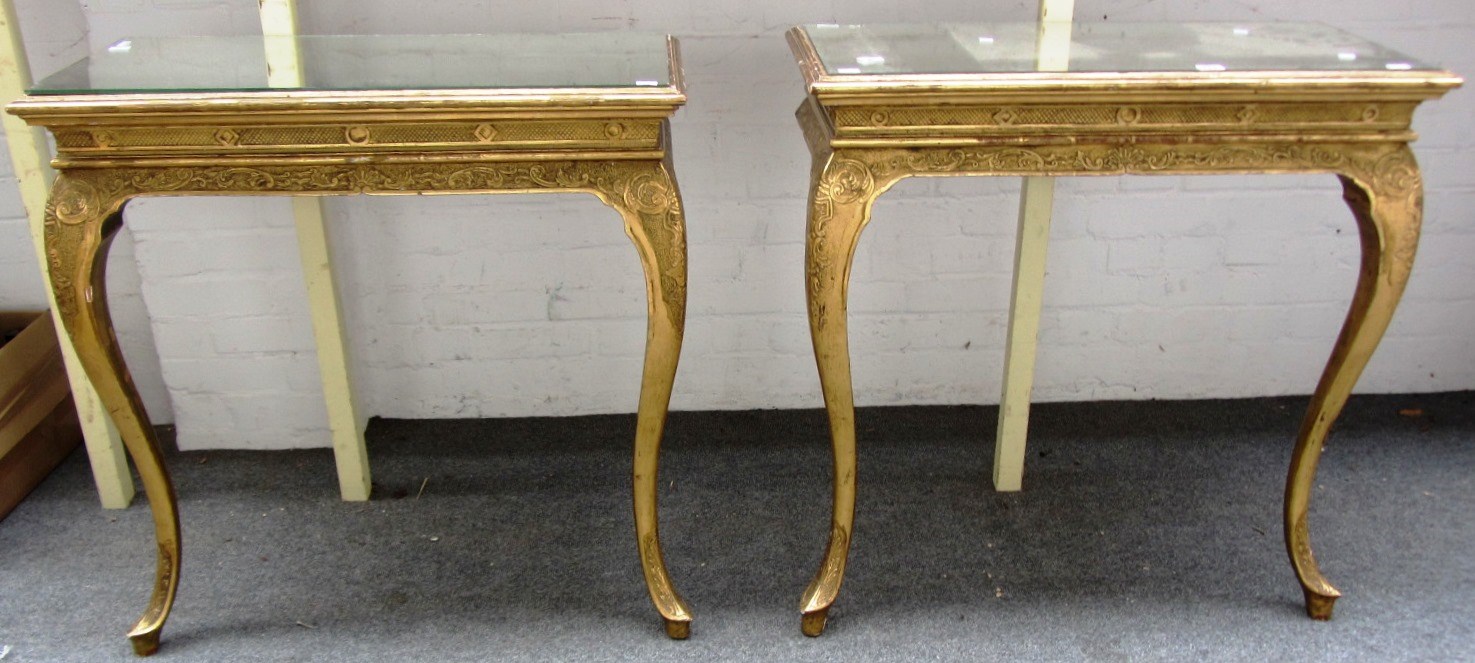 Appraisal: A pair of Victorian giltwood console tables each with mirror