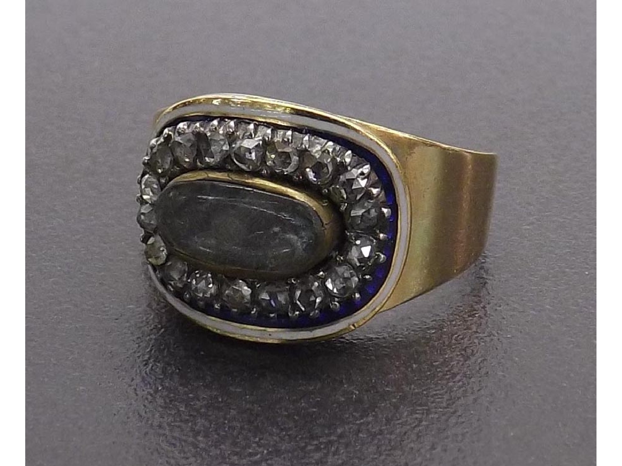 Appraisal: Georgian gold diamond and enamel mourning ring the oval section