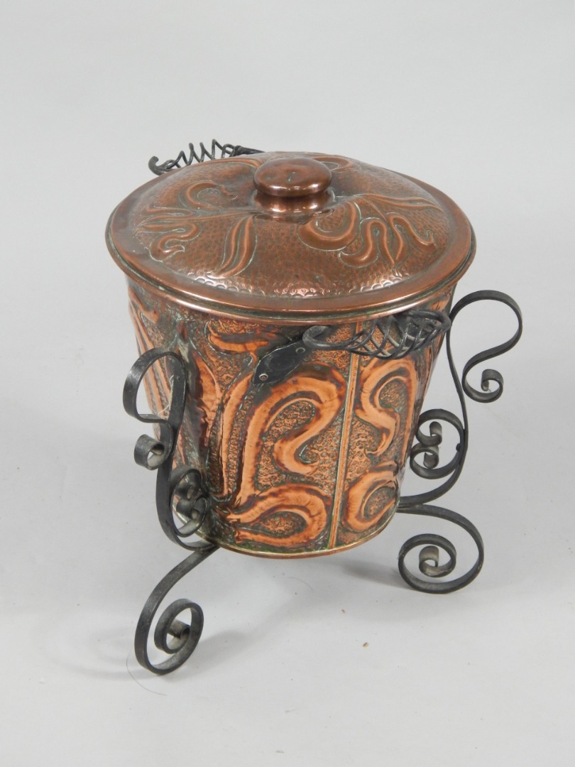 Appraisal: An Art Nouveau copper and cast iron coal bucket and