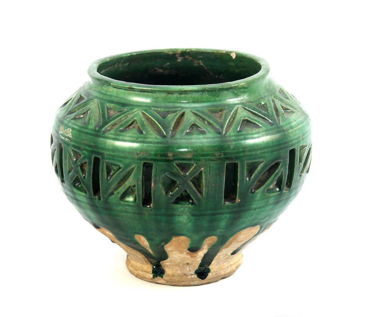 Appraisal: A green glazed pierced pottery lamp North East Iran th