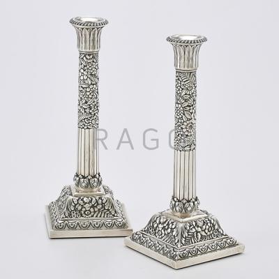 Appraisal: TIFFANY CO STERLING REPOUSSE CANDLESTICKS Half-reeded and floral columns below