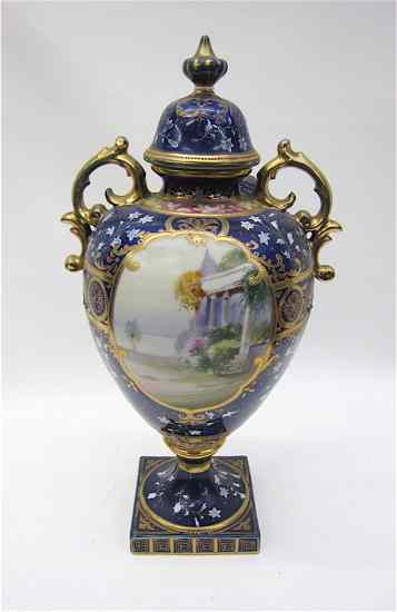 Appraisal: FRENCH ''SEVRES'' PORCELAIN COVERED URN hand painted with royal blue