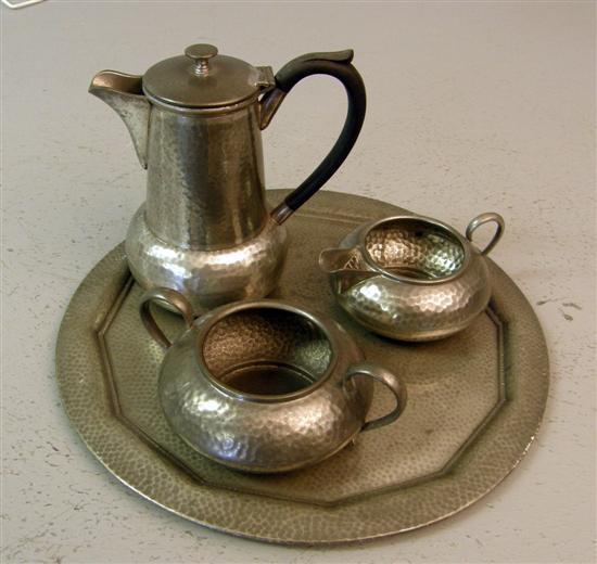 Appraisal: Arts and Crafts pewter three piece tea service and tray