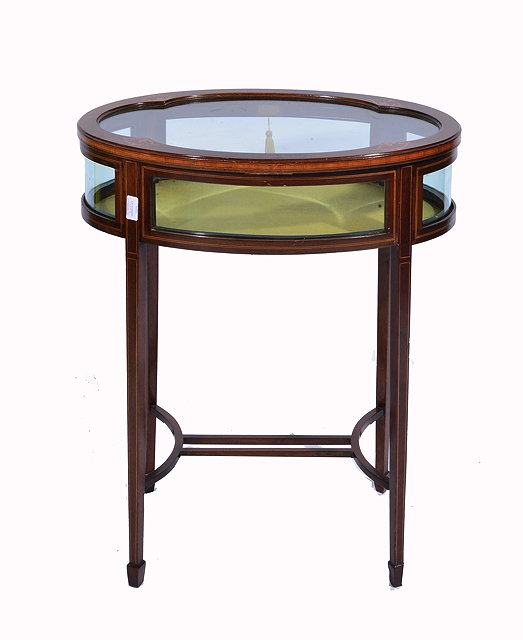 Appraisal: AN OVAL MAHOGANY BIJOUTERIE TABLE with inlaid boxwood decoration to