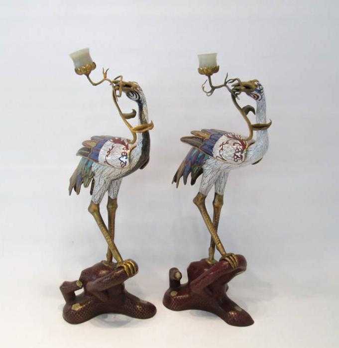 Appraisal: PAIR OF CHINESE CLOISONNE STANDING CRANE SCULPTURES holding metal branches