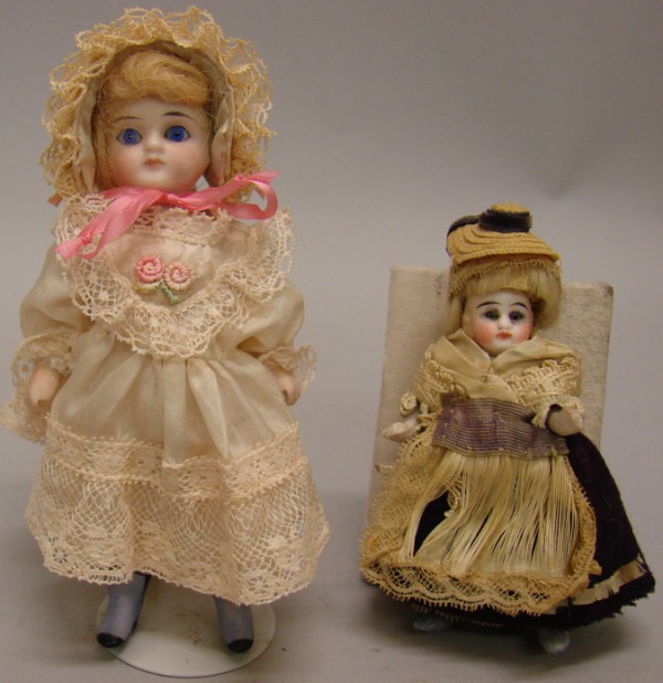 Appraisal: Pair of wire strung dolls with stationary eyes Has a