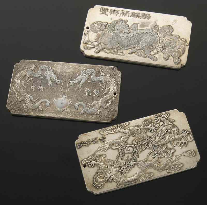 Appraisal: Chinese silver plaques depicting dragons and Qilin ''H x ''W