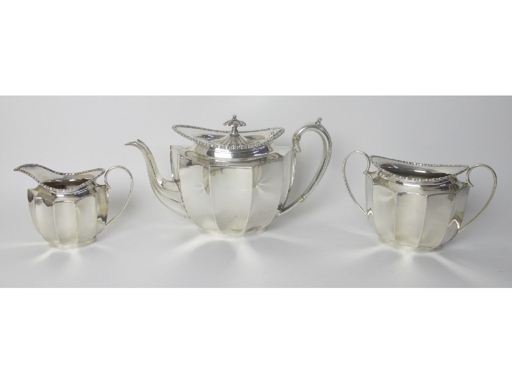 Appraisal: A silver three piece tea service with fluted sides Sheffield