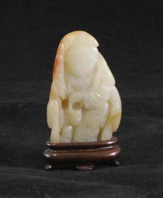 Appraisal: A Chinese white and russet jade figure of Tan Zi