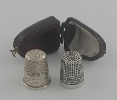 Appraisal: Two Chester thimbles one with engraved decoration by Charles Horner