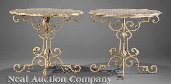 Appraisal: A Pair of Wrought Iron Garden Tables with Travertine Tops