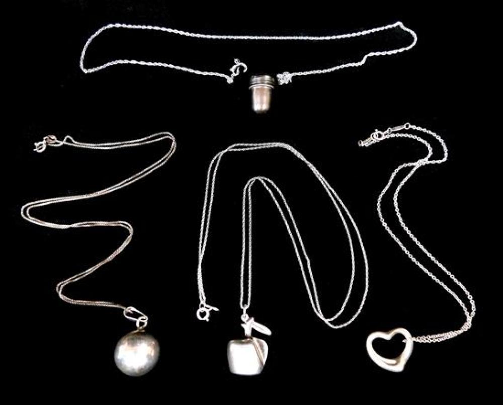 Appraisal: SILVER Four pendant necklaces including Tiffany including three silver including