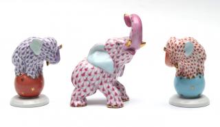 Appraisal: A trunk up elephant and two dancing elephants hand-painted with