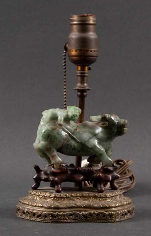 Appraisal: Chinese carved jade group of a boy riding a water