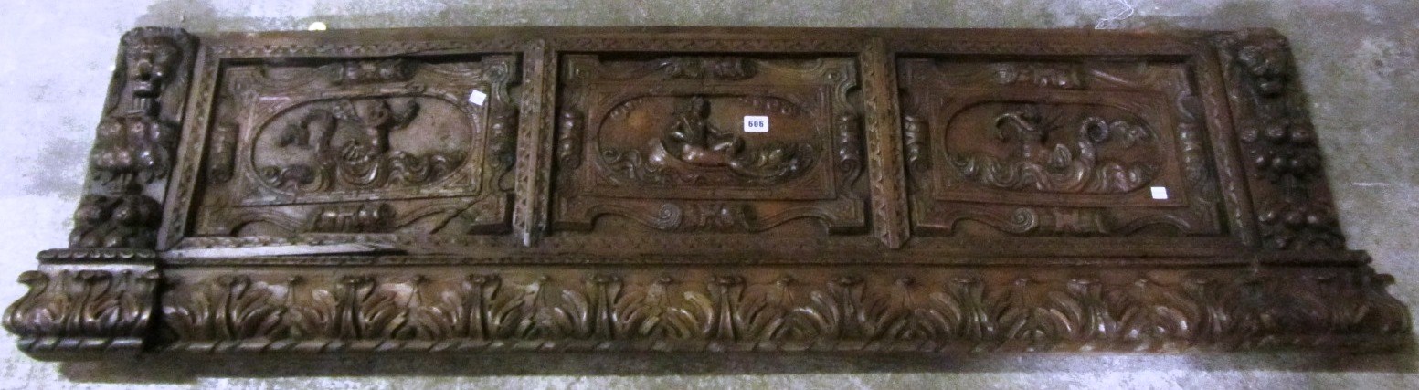 Appraisal: A th century Italian walnut triple panel carved cassone front