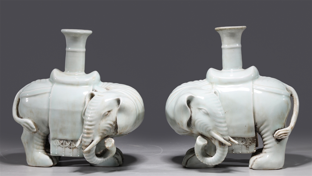 Appraisal: Pair of Chinese elephant-form pale celadon glazed candlesticks as-is condition