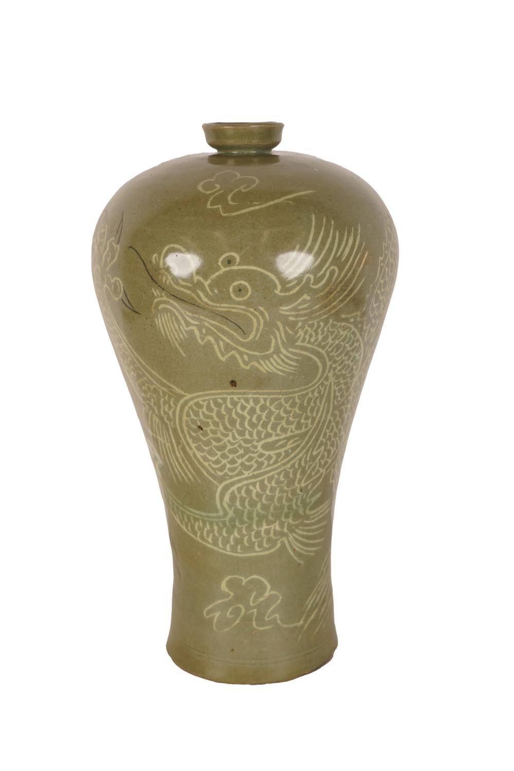 Appraisal: CHINESE CELADON CERAMIC VASEunmarked with dragon design inches high Condition